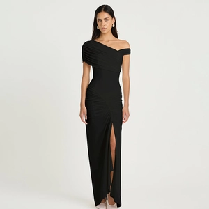 Detail of elegant black off-shoulder ruched maxi dress with high side slit and mesh fabric