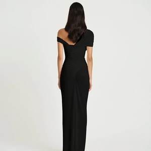 Close-up of ruched back detail and slim fit design on black off-shoulder maxi dress