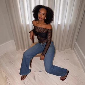 Sexy black lace off-shoulder long sleeve top with mesh lining and slim fit design