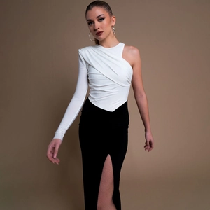 Slim fit one-shoulder patchwork dress in black and white with high split and long sleeve