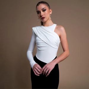 Detail of white one-shoulder long sleeve top with elegant crossover pleats and ribbed fabric