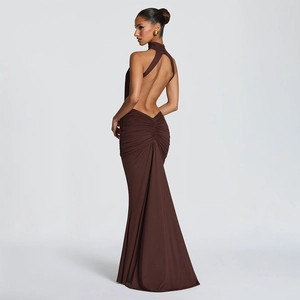 Rear view detail of a dark brown backless dress with ruched mermaid skirt design
