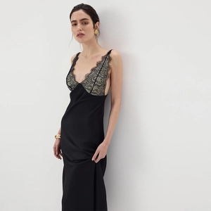 Detailed view of the delicate grey lace trim on a black satin bodycon slip dress