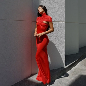 Detail of red bodycon dress featuring elegant neck cutout and ruched gathered fabric