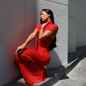 Close-up of red bodycon dress featuring high neckline and premium elastic fabric details