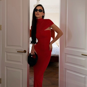 Close-up of the elegant turtleneck red bodycon dress featuring shoulder cutout and pleats