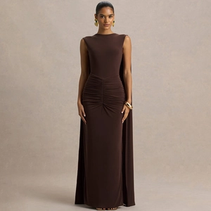 Detail of elegant back cape and pleated waist on a brown sleeveless evening gown