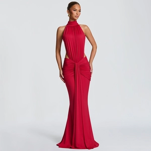 Detail of the waist cut-out and elegant ruched fabric on this red halter evening gown