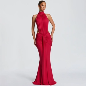 Detail of red halter neck fishtail dress featuring waist cutout and elegant pleated texture