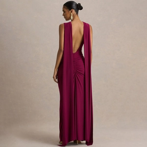 Macro view of the backless detail with drapes on a dark purple evening gown