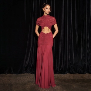 Detail of burgundy evening gown showing ruched high neck and diamond waist cutouts