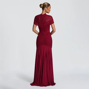 Detailed back view of burgundy evening dress with high neck and ruching mesh texture