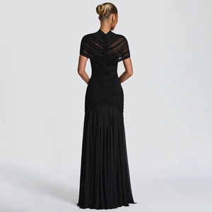 Detailed back view of pleated black mesh evening gown with zipper and elegant drape