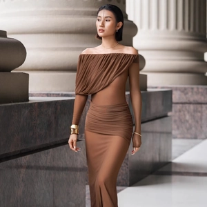 Detail of the horizontal pleats and drapery on this brown off-the-shoulder slim maxi dress