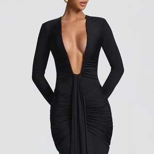 Detail showing the deep V-neckline and ruched texture on this black long sleeve dress