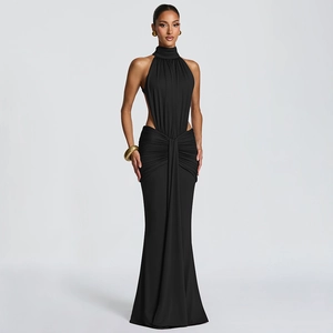 Detail of elegant black halter neck gown featuring side waist cut-outs and mermaid hem