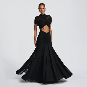 Detail of waist cutout and ruched mesh texture on this elegant black fishtail maxi dress