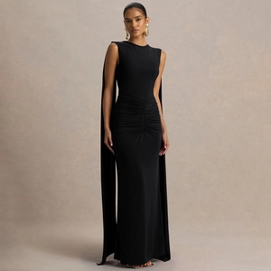 Detail of elegant black gown with backless cape design and pleated slim fit texture