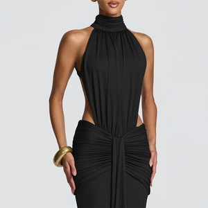 Detail of elegant black halter dress featuring waist cut-out and draped pleats styling