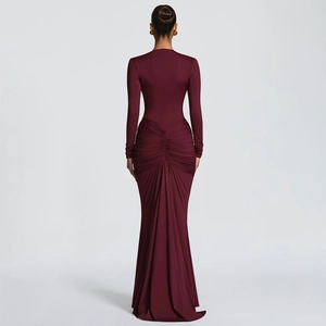 Detail of ruched back and fishtail hem on this elegant burgundy long sleeve evening dress