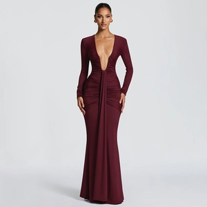 Close-up of elegant pleated detailing and draped sash on this burgundy V-neck evening gown