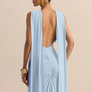 Detailed back view of light blue backless dress with ruched texture and long sashes