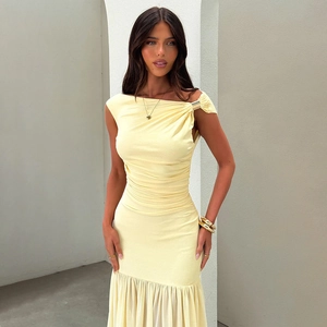 Detailed view of the elegant one-shoulder knot and gathered pleats on this light yellow dress