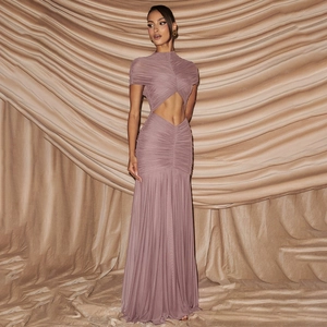 Detail of ruched evening dress featuring waist cut-out and draped fish-tail mesh fabric