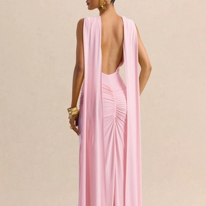 Detail of light pink backless evening gown with pleated waist and draped shawl design