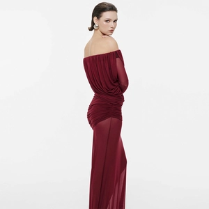 Detail of burgundy ruched mesh evening dress showing off-shoulder fit and texture