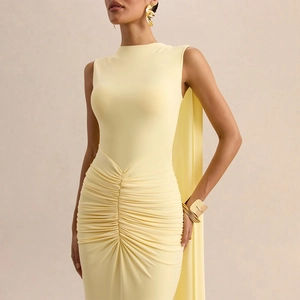 Detail of light yellow sleeveless evening dress with ruched waist and elegant cape back