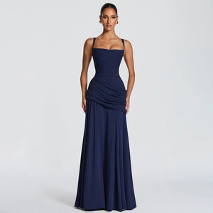 Detail view of the elegant navy blue ruched bodice and wide straps on a long formal dress