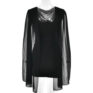 Detail of elegant black bodycon dress with sheer chiffon cape and open back design