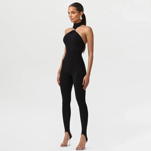 Detail of sexy black halter neck jumpsuit featuring metal ring and stirrup leggings