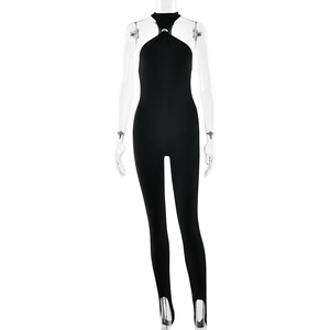 Sexy black halter neck stirrup jumpsuit with metallic ring detail for women