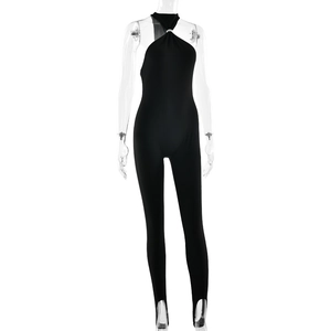 Detail of black halter neck jumpsuit with silver ring buckle and stirrup legs