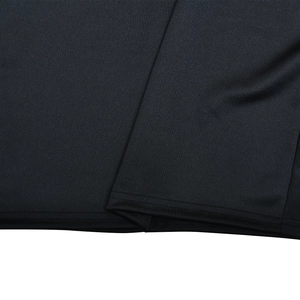 Detail shot of the black bodycon dress showing high-quality double-needle hem stitching
