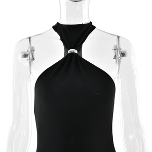 Detail of black halter neckline featuring a silver metal ring and soft pleated fabric textures