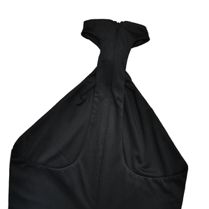 Detail of black halter neckline with hidden back zipper on sleek slim jumpsuit