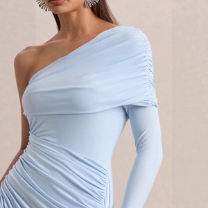 Detail of ruched light blue one-shoulder dress with elegant long sleeve and fine fabric
