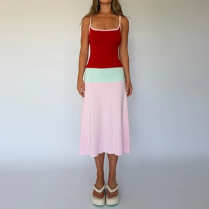 Detail view of the contrast color block stitching on the slim fit spaghetti strap maxi dress