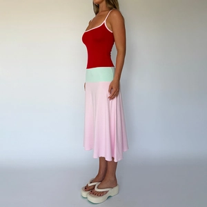 Detail of color-block patchwork dress with thin straps and slimming silhouette