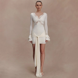 Detail of elegant ivory lace V-neck dress with waist wrap ties and ruffled sleeves