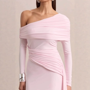 Detail of light pink one-shoulder dress featuring elegant ruching and long sleeve design