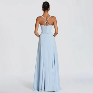 Detail of the cross-back straps and pleated back on a light blue bodycon maxi dress