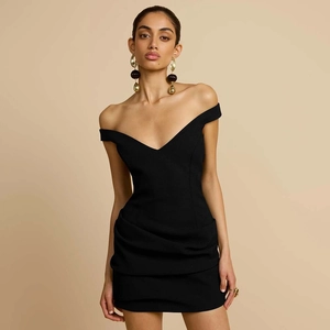 Detailed view of black off-shoulder dress with elegant side ruching and slim fit design