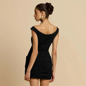 Close-up of the backless design and sleek black fabric on a slim-fit off-shoulder dress