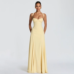 Detail of butter yellow backless maxi dress with pleated sweetheart neckline and slim fit