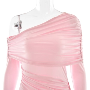 Detail shot of the pink one-shoulder dress showing the ruching craft and soft fabric texture