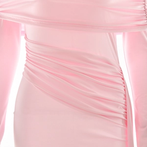 Close-up of ruched texture and elastic fabric on this pink slim-fit bodycon dress